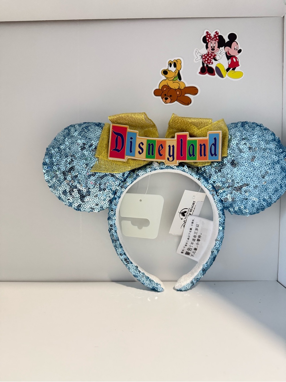Disney Light Blue Sequin Minnie Ears Headband with Gold Bow and Disneyland Badge